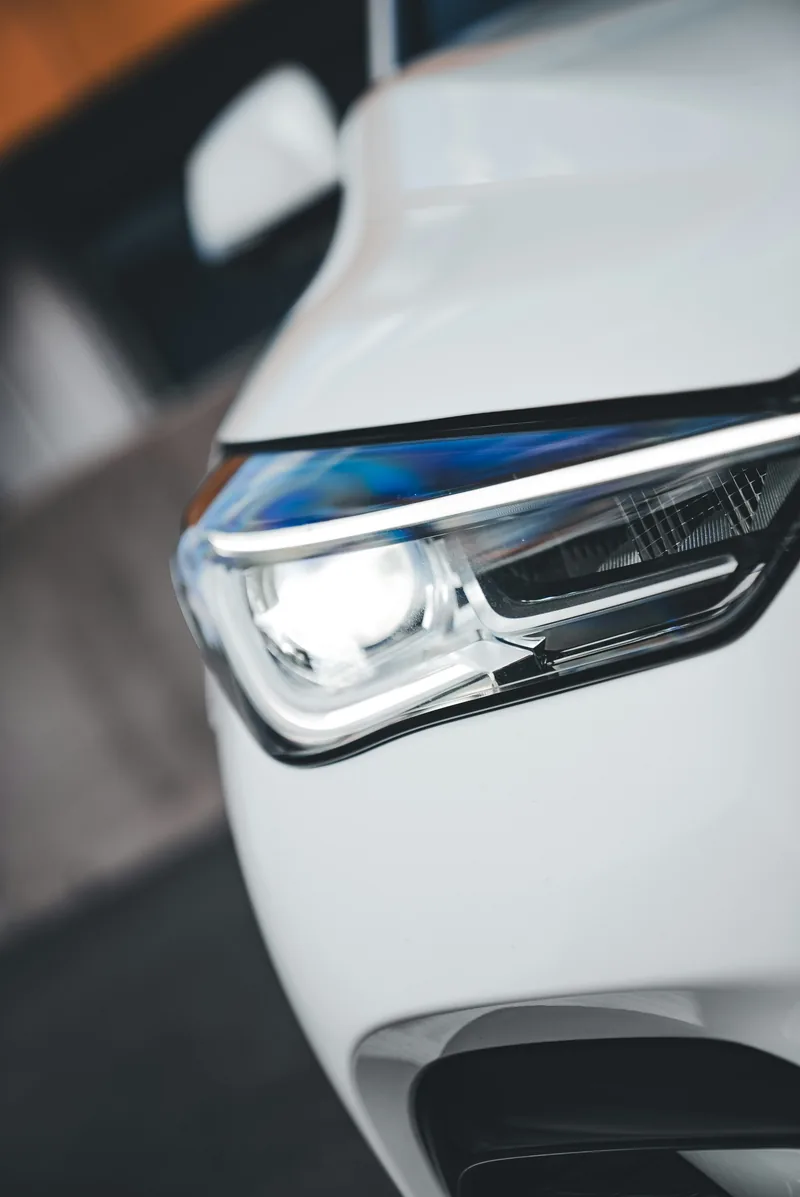 LED headlight assembly on a white vehicle